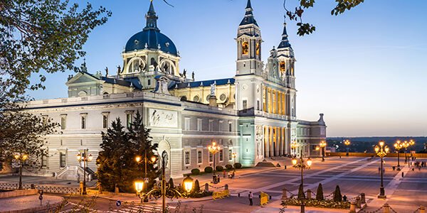 Madrid, Spain at La Almudena Cathedral and the Royal Palace.